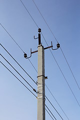 Image showing Concrete electric pole with wires against the sky