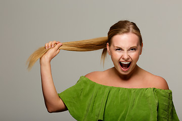 Image showing Screaming model with bare shoulders