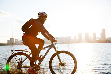 Image showing Girl in helmet on bicycle