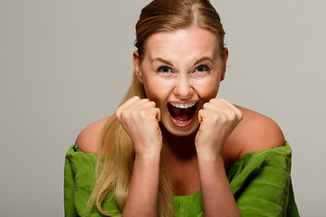 Image showing Screaming woman in green dress