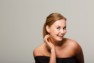 Image showing Smiling girl in black dress