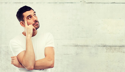 Image showing man thinking over gray background