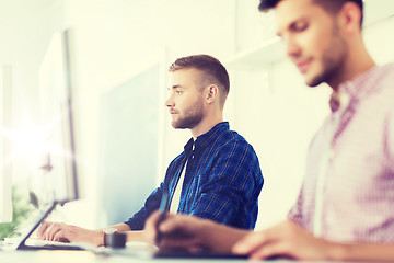 Image showing creative man or student with computer at office