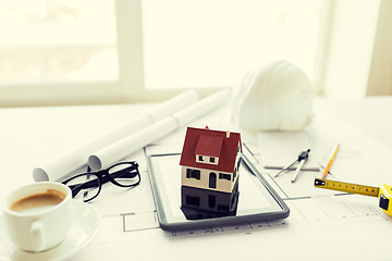 Image showing close up of living house model on tablet pc