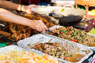 Image showing seller with rice and wok food at street market