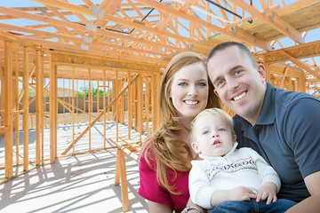 Image showing Young Military Family Inside The Framing of Their New Home at Co