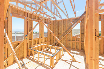 Image showing Wood Home Framing Abstract At Construction Site.