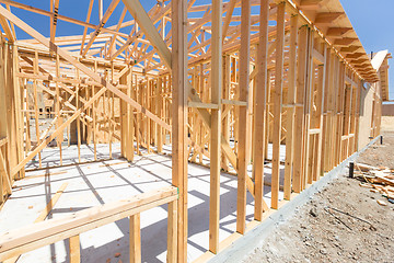 Image showing Wood Home Framing Abstract At Construction Site.