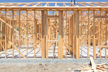 Image showing Wood Home Framing Abstract At Construction Site.