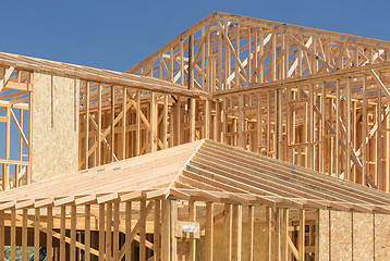 Image showing Wood Home Framing Abstract At Construction Site.