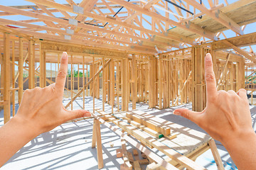 Image showing Hands Framing Inside New Home Construction Framing.