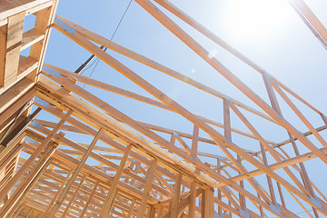 Image showing Wood Home Framing Abstract At Construction Site.