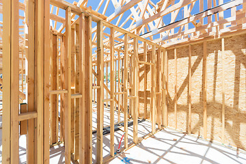 Image showing Wood Home Framing Abstract At Construction Site.