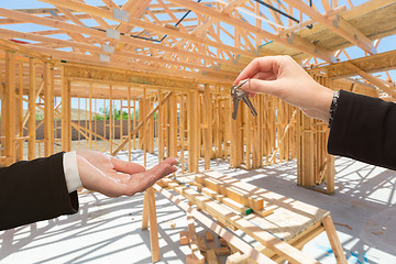 Image showing Handing Over The Keys On Site Inside New Home Construction Frami