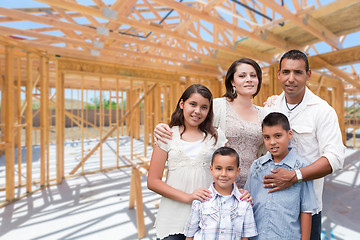 Image showing Young Hispanic Family On Site Inside New Home Construction Frami