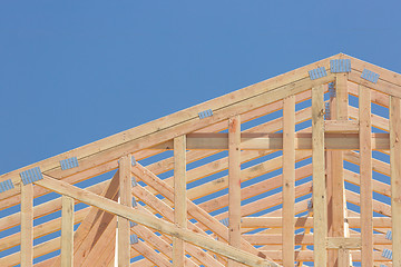 Image showing Wood Home Framing Abstract At Construction Site.