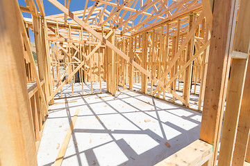 Image showing Wood Home Framing Abstract At Construction Site.