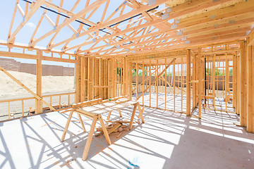 Image showing Wood Home Framing Abstract At Construction Site.