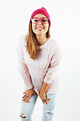 Image showing young pretty teenage hipster girl posing emotional happy smiling on white background, lifestyle people concept 