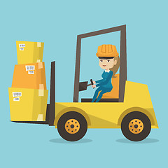 Image showing Warehouse worker moving load by forklift truck.