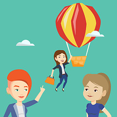 Image showing Business woman hanging on balloon.