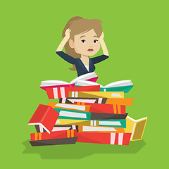 Image showing Student sitting in huge pile of books.