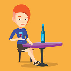 Image showing Woman drinking wine at restaurant.