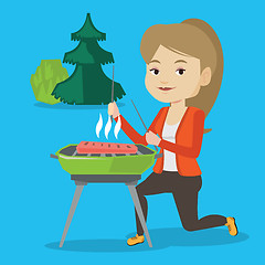 Image showing Woman cooking steak on barbecue grill.