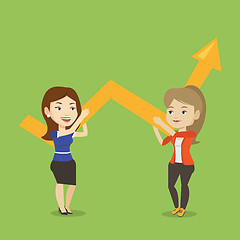 Image showing Two business women holding growth graph.