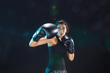 Image showing The female boxer training at sport club