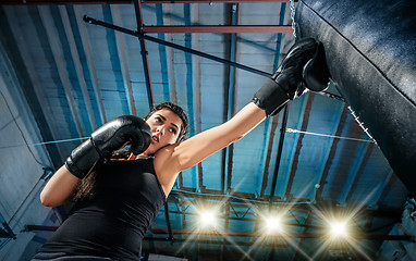 Image showing The female boxer training at gym