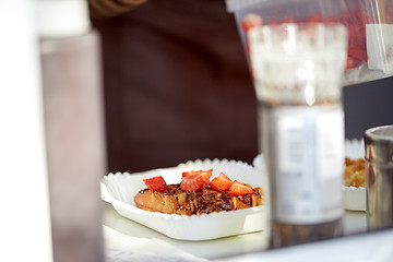 Image showing waffle with strawberry on paper plate and fork