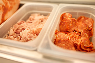 Image showing containers with ham and salami at restaurant