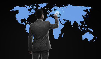 Image showing businessman working with virtual world map