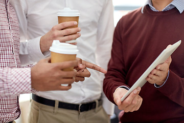 Image showing business team with tablet pc and coffee at office