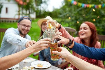 Image showing happy friends with drinks at summer garden party