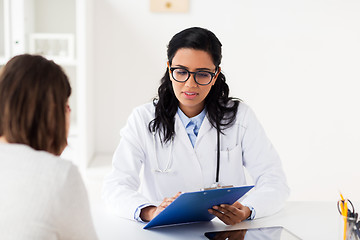 Image showing doctor with clipboard and woman at hospital