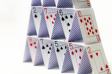 Image showing house of playing cards over white background