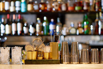 Image showing shakers, glasses, stirrers and strainers at bar
