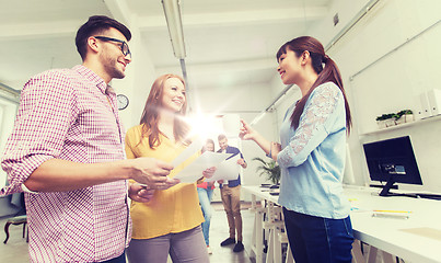 Image showing creative team on coffee break talking at office