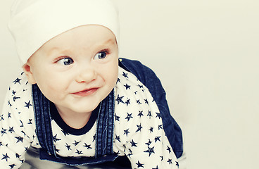 Image showing little cute baby toddler on carpet isolated close up smiling ado