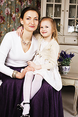 Image showing young mother with daughter at luxury home interior vintage