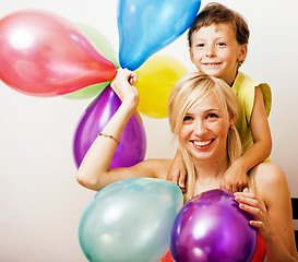Image showing pretty real family with color balloons on white background, blon