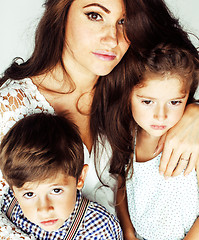 Image showing young mother with two children on white, happy smiling family in