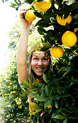Image showing pretty islam woman in orange grove smiling, real muslim girl che