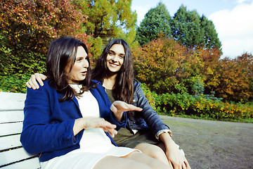 Image showing mature real mother with daughter outside autumn fall in park