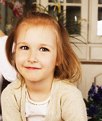 Image showing little cute blonde european girl playing at home interior, lifes