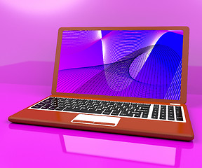 Image showing Red Computer On Desk With Spiral Pattern