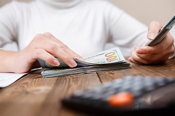 Image showing Hands counting money, close up