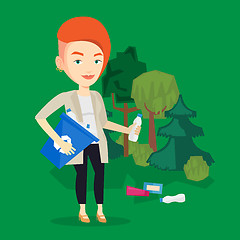 Image showing Woman collecting garbage in forest.